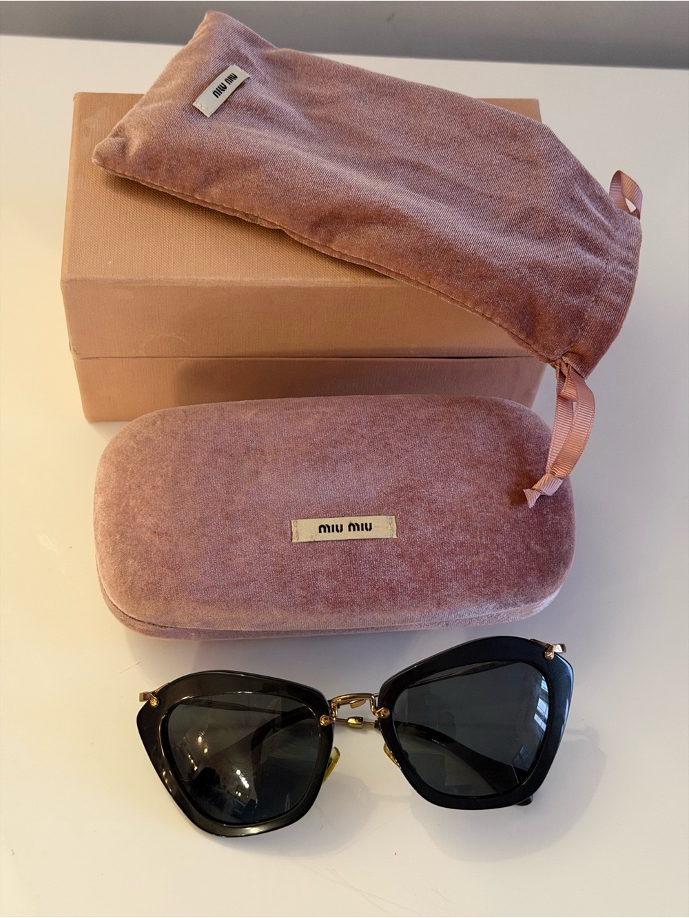 Miu Miu Black Cat-Eye Sunglasses with Pink Velvet Case